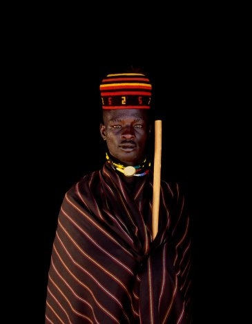 Karamojong man of Uganda by Harry Hook