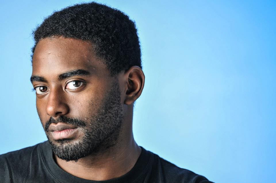 jerron-in-blue-background-headshot